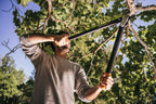 Fiskars PowerGear Amboss-Getriebeastschere für trockene Zweige und Äste, Schneide und stumpfes Gegenstück, Antihaftbeschichtet, Gehärteter Präzisionsstahl, Länge: 69 cm, Schwarz/Orange, L77, 1000583